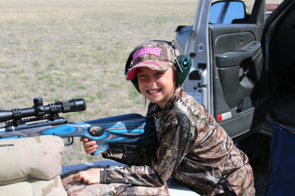 Child learning to shoot